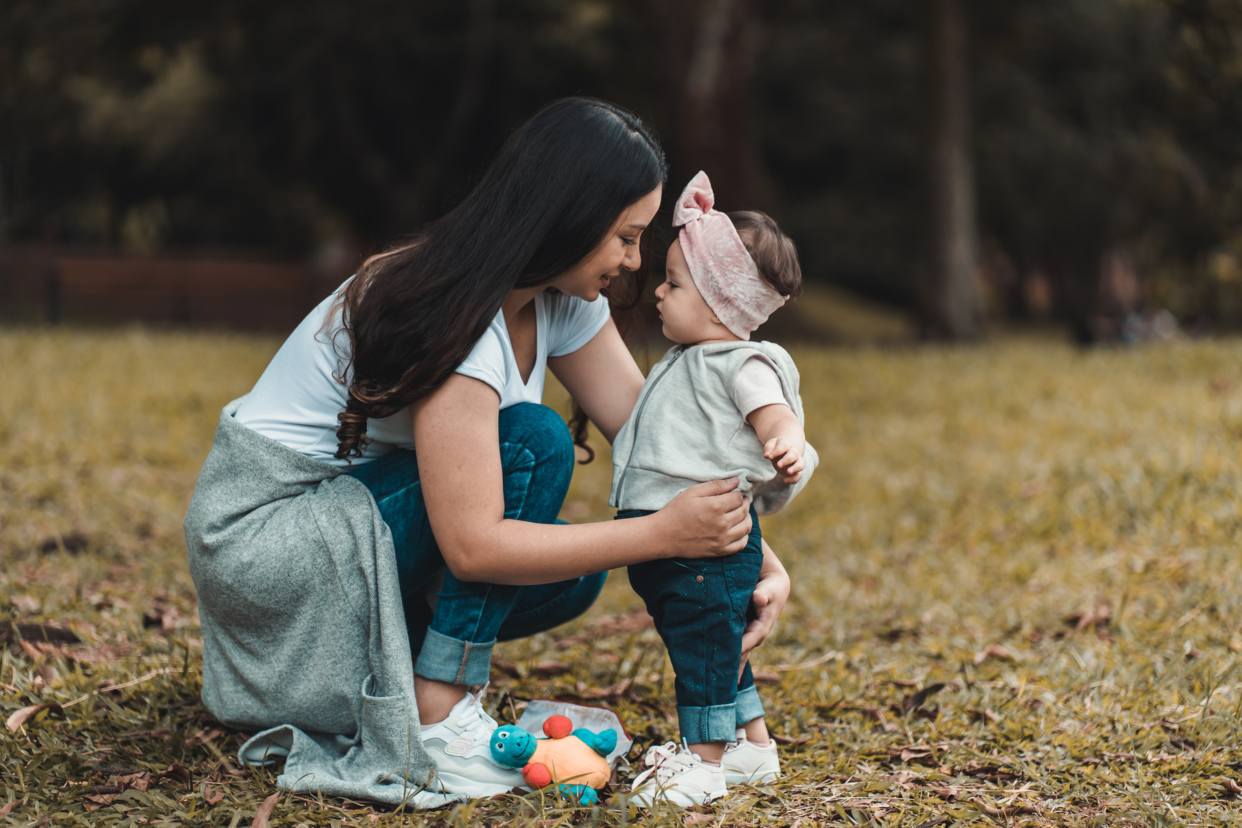 Loving mother with baby on lawn